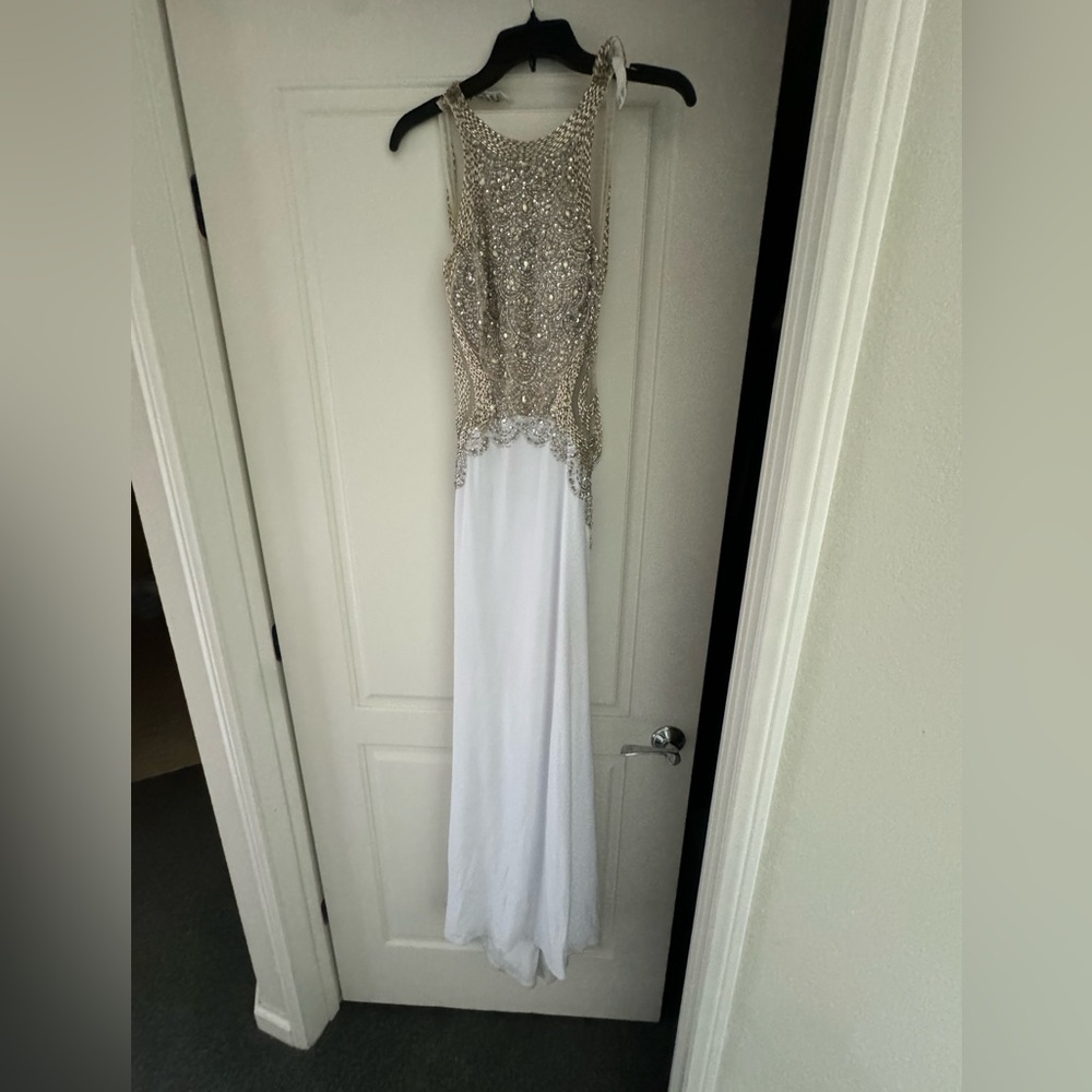 White sequin long dress with an open back.